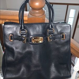 Michael Kor’s black leather satchel